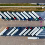 parked FTL trucks waiting to be loaded for freight shipping