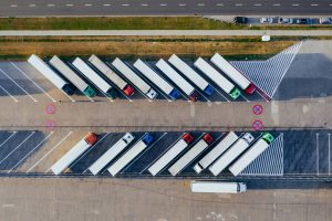 parked FTL trucks waiting to be loaded for freight shipping