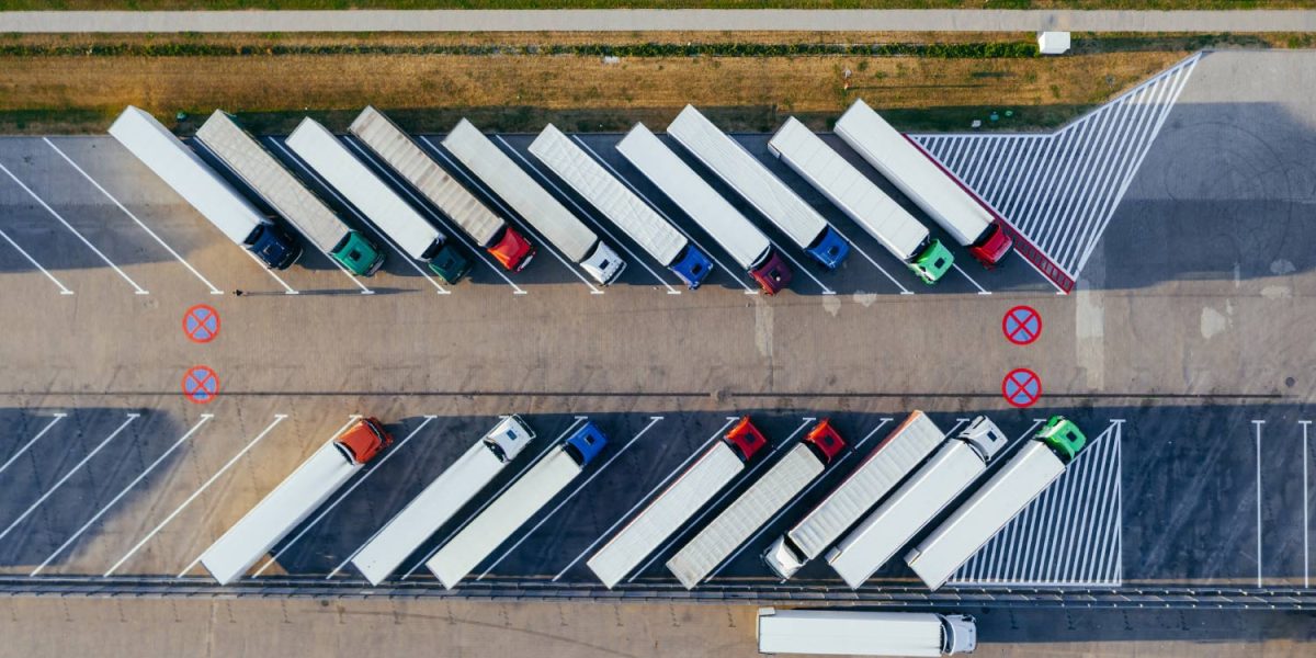 parked FTL trucks waiting to be loaded for freight shipping